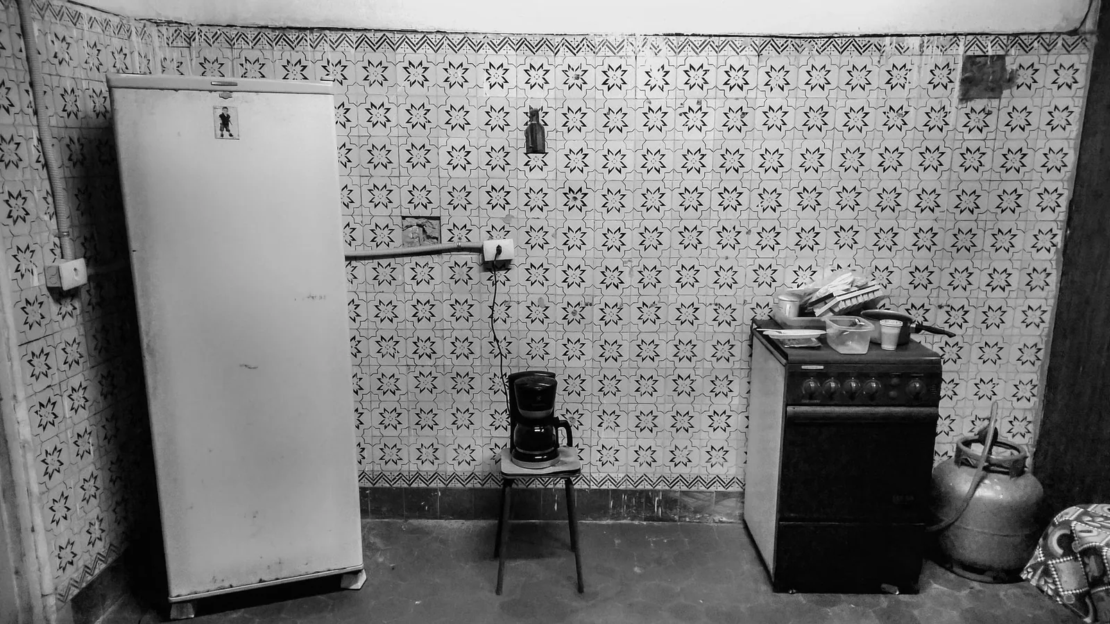 Before: a stripped-back apartment kitchen awaiting rebuild